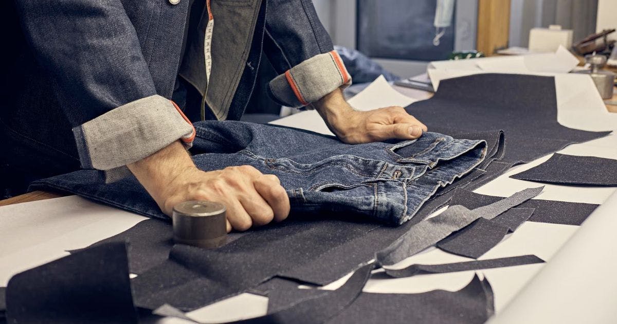 Man making jeans pants