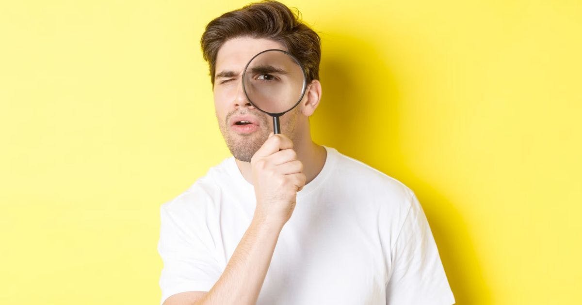 Man searching with magnifying glasses